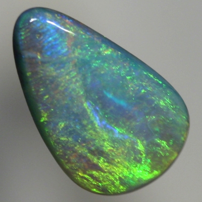 SOLID SEMI BLACK OPAL Glowing with bright greens over a beautiful blue